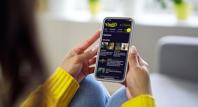 Smartphone mockup. Closeup of woman using mobile phone with empty screen at home